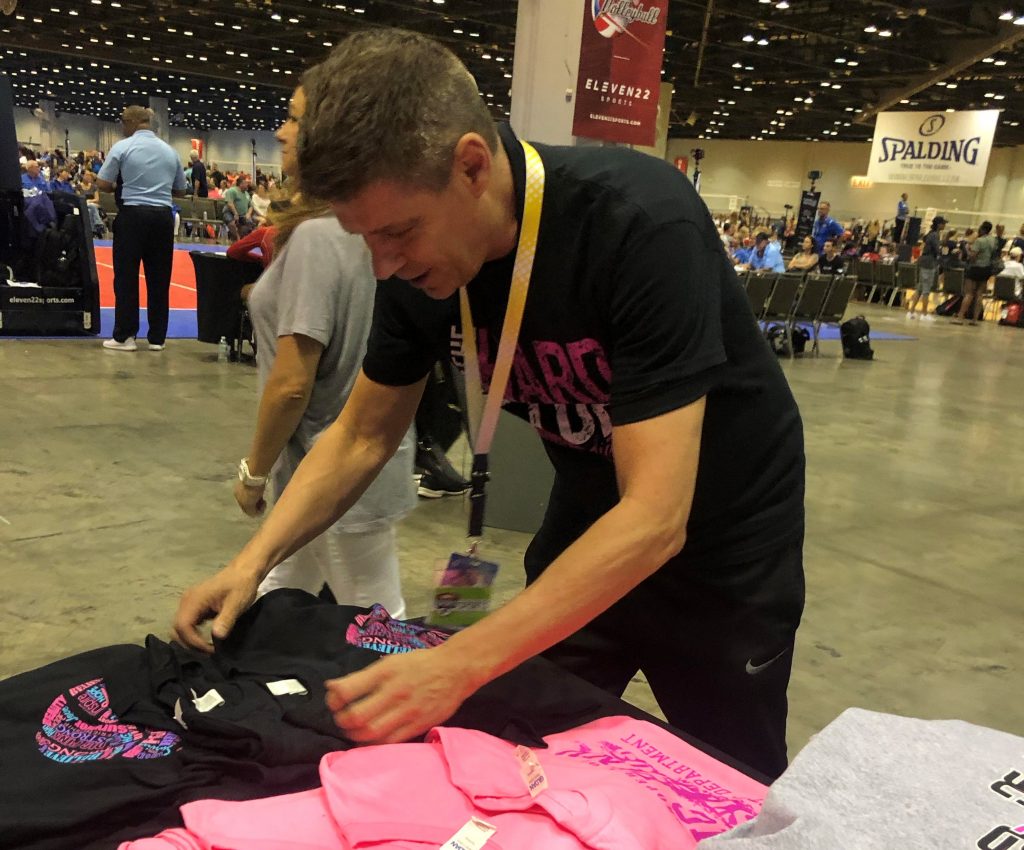 Tim folding at the booth
