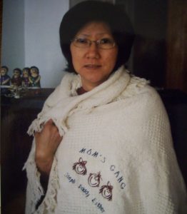 Esther's mom sporting the "Mom's Gang" blanket
