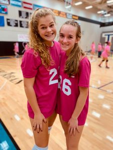 Players pose together at Dig Pink game