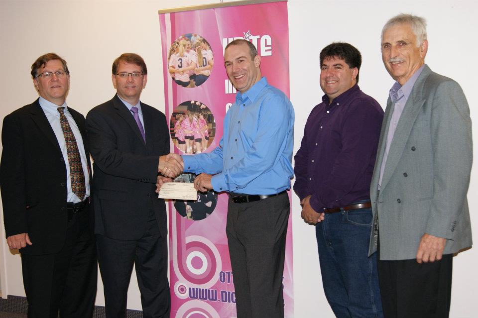 Rick Dunetz presents the check to FNIH (from left to right:  David Wholley (director, The Biomarkers Consortium, FNIH), Dr. Scott Campbell (executive director and CEO, FNIH), Rick Dunetz (founder and executive director, Side-Out), Dr. Emanuel (Chip) Petricoin (co-director, GMU Center for Applied Proteomics and Molecular Medicine) and Bryant Dunetz (Rick's dad and COO, Side-Out))