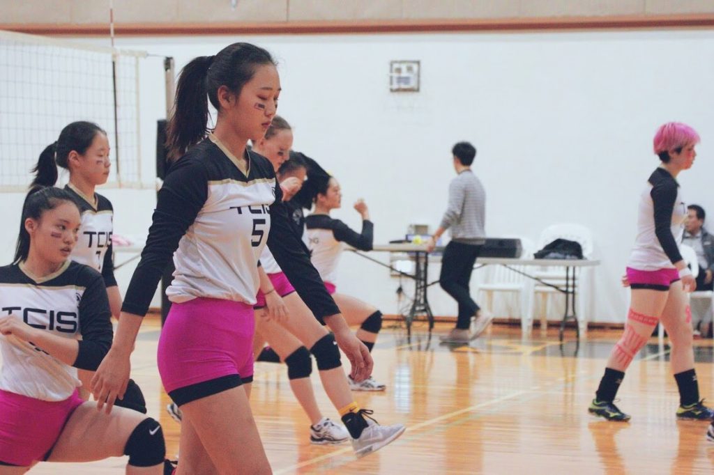 Libby warming up with her volleyball team.