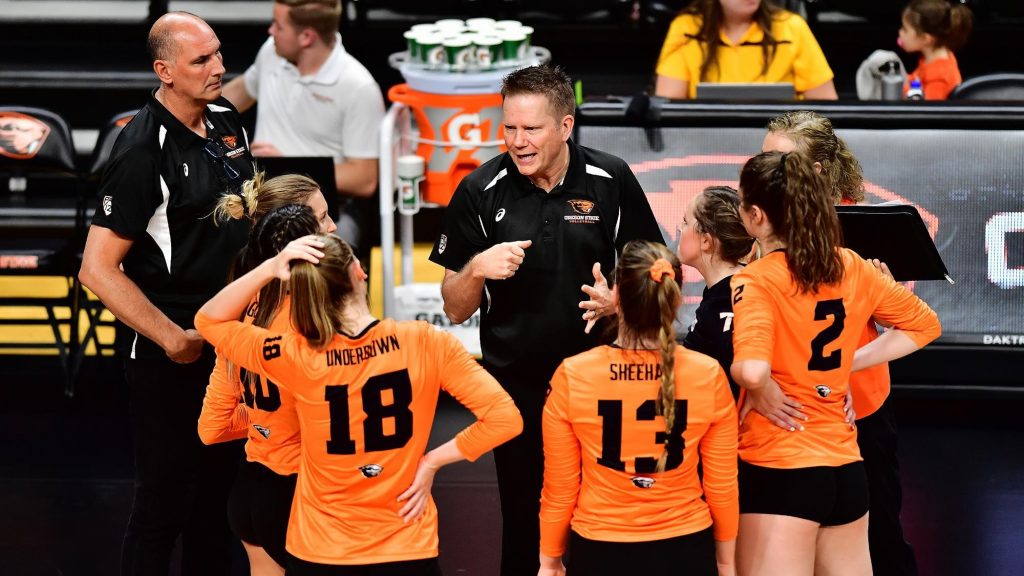 Oregon State Head Volleyball Coach in Team Huddle