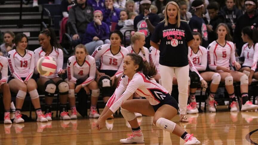 volleyball player focusing on a dig