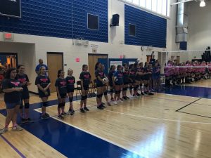 Lineup of the middle school's teams during the Dig Pink event