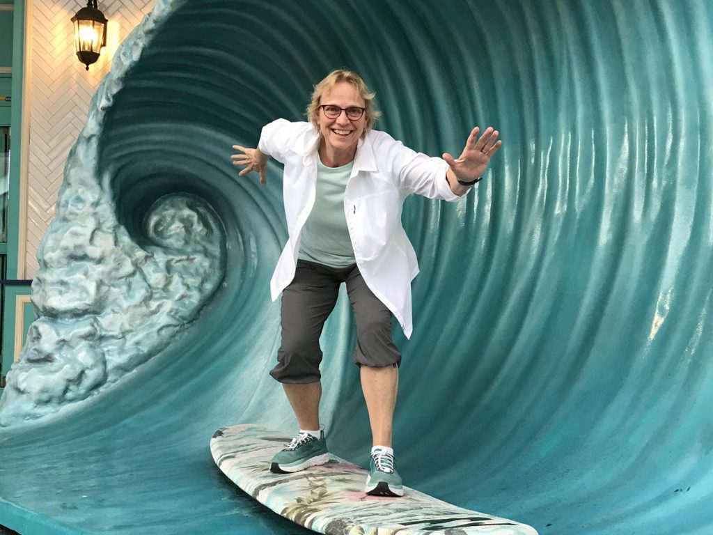 Janice surfing the waves
